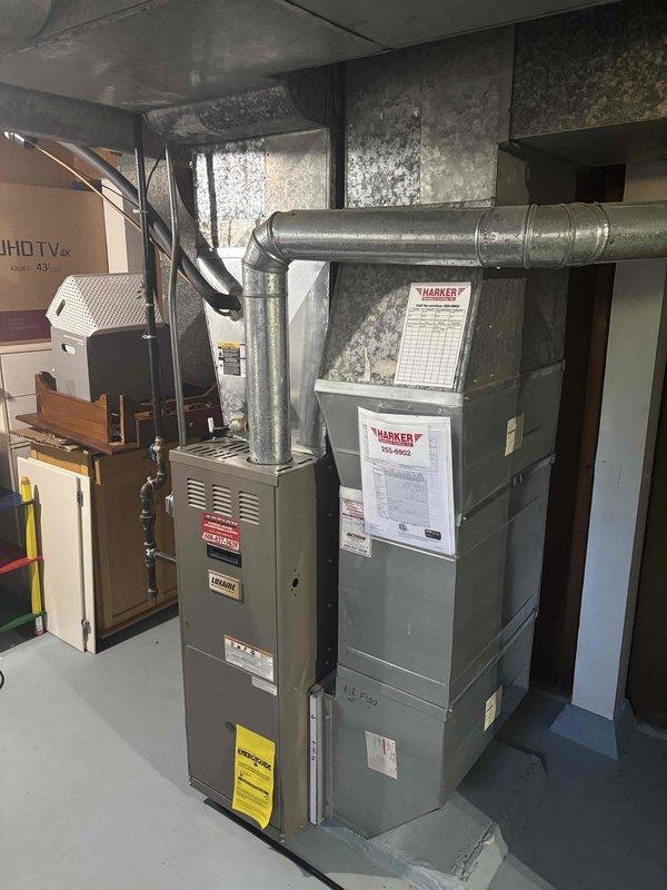 Responded to no heat call on residential furnace system. Performed diagnostic inspection of Harker brand furnace unit and associated HVAC equipment in basement mechanical room. Verified system operation, checked electrical connections, inspected ductwork, and confirmed proper airflow through metallic supply plenum. System restored to normal heating operation with no further issues identified.