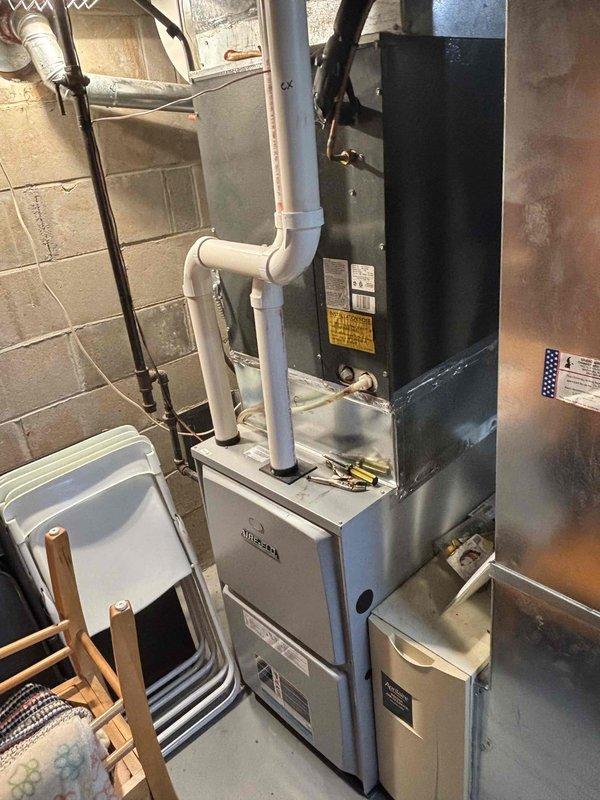 Completed prepaid clean and check heating visit on residential furnace system as part of recurring maintenance program. Performed comprehensive inspection of furnace unit, air handler, and associated HVAC components including humidifier, ductwork, and condensate drain lines. All equipment found operating within normal parameters with no immediate service needs identified.