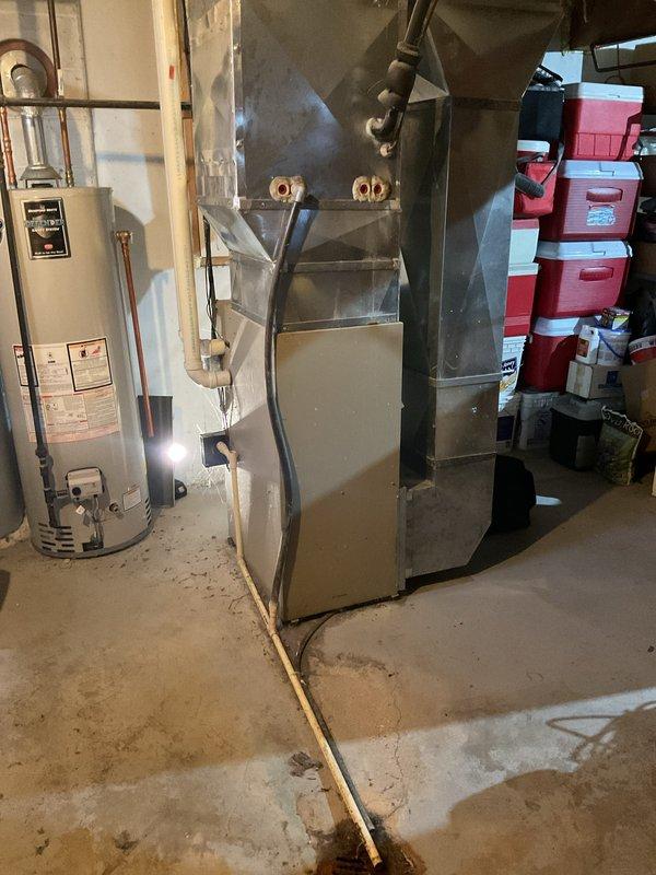 Responded to service call for furnace making abnormal whirring sound on approximately 20-year-old heating unit. Upon arrival, performed visual and auditory inspection of the furnace system located in basement utility area. Accessed lower blower compartment to examine blower motor assembly and internal mechanical components for signs of wear, debris accumulation, or bearing failure that could cause the reported whirring noise. Inspected blower wheel for balance issues, foreign objects, or buildup that may contribute to unusual operational sounds. Evaluated motor mounts and housing for looseness or vibration. Checked belt-drive components if applicable and assessed overall condition of aging equipment given the unit's service life exceeding typical lifespan expectations.