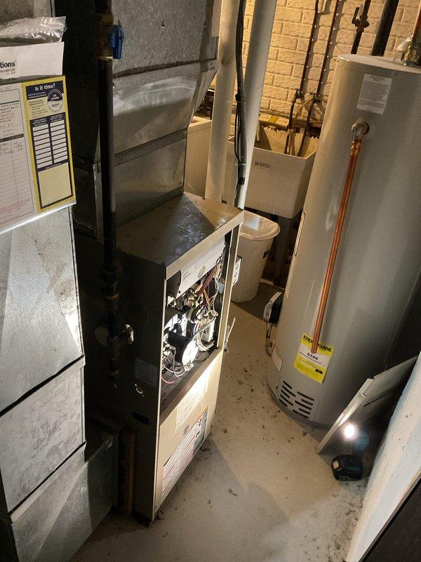 Responded to service call for furnace making abnormal whirring sound on approximately 20-year-old heating unit. Upon arrival, performed visual and auditory inspection of the furnace system located in basement utility area. Accessed lower blower compartment to examine blower motor assembly and internal mechanical components for signs of wear, debris accumulation, or bearing failure that could cause the reported whirring noise. Inspected blower wheel for balance issues, foreign objects, or buildup that may contribute to unusual operational sounds. Evaluated motor mounts and housing for looseness or vibration. Checked belt-drive components if applicable and assessed overall condition of aging equipment given the unit's service life exceeding typical lifespan expectations.