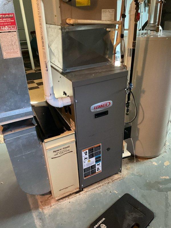 Performed comprehensive furnace tune-up on Lennox single-stage heating system, including installation of new Spaceguard 220 filter (20x25x5). Verified igniter resistance at 33 ohms and confirmed safe combustion with CO reading of 7 ppm. Cleaned flame sensor, cleared drain trap, inspected and tightened all electrical connections at control board, and blew out pressure sensor ports at inducer and header box. Unit tested and confirmed operating with proper heating output.