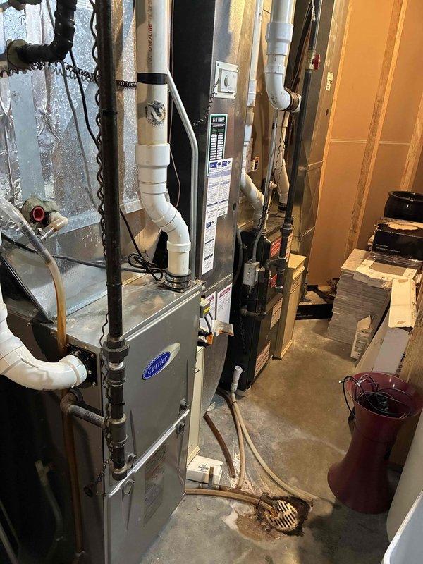 Completed furnace clean and check on both Goodman and Carrier residential HVAC units located in basement utility room. Performed thorough cleaning of both furnace systems, inspected all components including heat exchangers, blower assemblies, and venting systems. Verified proper operation of both units, checked electrical connections, and ensured all safety controls were functioning correctly.
