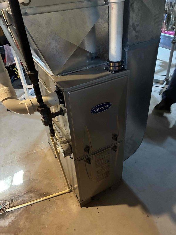 Completed preventive maintenance heating visit on residential Carrier forced-air furnace system. Performed thorough cleaning of unit components and conducted comprehensive operational check of all system functions. Unit is operating properly with all safety controls verified and functioning as designed.
