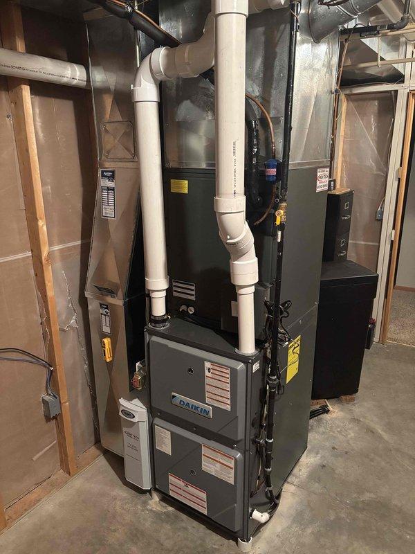 Completed prepaid maintenance visit performing both heating and cooling system inspections on Daikin HVAC equipment. Conducted comprehensive furnace clean and check including burner inspection, heat exchanger examination, and filter service. Performed air conditioning clean and check on outdoor condensing unit, inspecting refrigerant levels, electrical connections, and cleaning condenser coils. Verified proper operation of both heating and cooling systems, confirmed adequate airflow through ductwork, and ensured all safety controls functioning correctly. All equipment operating within manufacturer specifications with no issues identified.