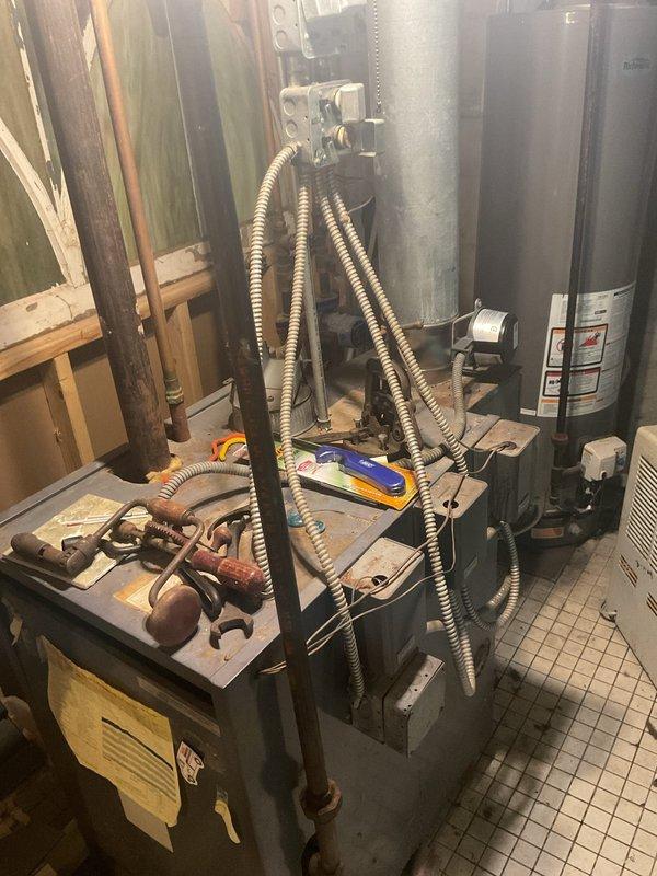 Responded to service call for boiler with extinguished pilot light. Successfully relit pilot on 40-year-old boiler unit after addressing issue with thermocouple switch. System restored to normal operation and verified proper flame ignition and burner function.