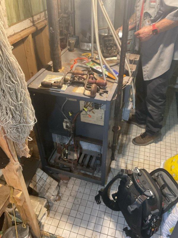 Responded to service call for boiler with extinguished pilot light. Successfully relit pilot on 40-year-old boiler unit after addressing issue with thermocouple switch. System restored to normal operation and verified proper flame ignition and burner function.