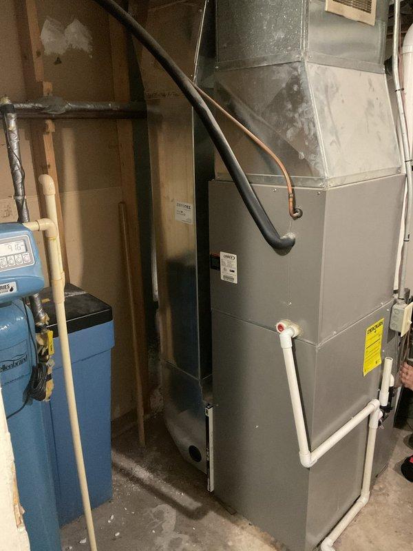 Completed furnace clean and check per standard maintenance protocol. Performed comprehensive inspection of heating system located in basement mechanical room, including visual assessment of furnace cabinet, ductwork connections, and condensate drainage system. Conducted diagnostic measurements using digital manometer, recording static pressure readings to verify proper airflow and system performance within manufacturer specifications. All components found operating normally with no deficiencies noted.