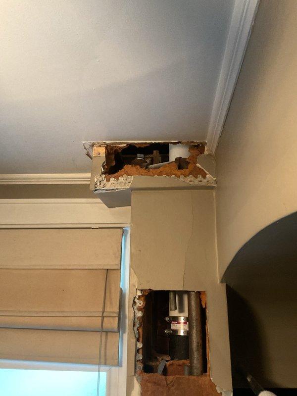 Removed final radiator from steam boiler system and properly capped supply line. Work included cutting access points in wall and ceiling to reach piping, disconnecting radiator connections, and installing permanent caps on steam supply pipes to isolate the removed unit from the active system.