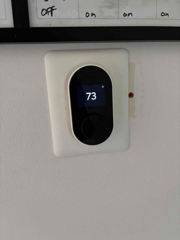 Completed clean and check tune-up on Unit 2 furnace located in left bathroom. Performed combustion analysis using Testo 310 analyzer, which showed oxygen levels at 7.2% and carbon dioxide at 768 ppm, indicating proper combustion efficiency. Verified thermostat operation and confirmed system is heating to setpoint of 73°F.