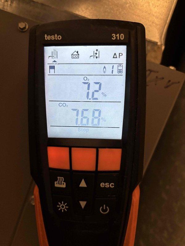 Completed clean and check tune-up on Unit 2 furnace located in left bathroom. Performed combustion analysis using Testo 310 analyzer, which showed oxygen levels at 7.2% and carbon dioxide at 768 ppm, indicating proper combustion efficiency. Verified thermostat operation and confirmed system is heating to setpoint of 73°F.