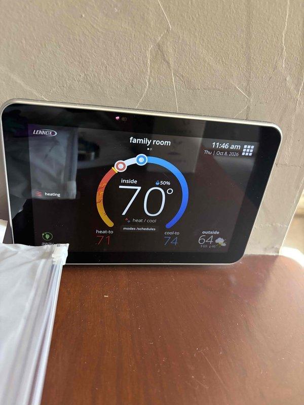 Responded to service call for thermostat issue. Inspected Lennox digital thermostat system controlling multiple zones including sun room and family room. Verified thermostat display functionality, temperature readings, and heating mode operation on both units. System found operating properly with accurate temperature control and zone management functioning as designed.