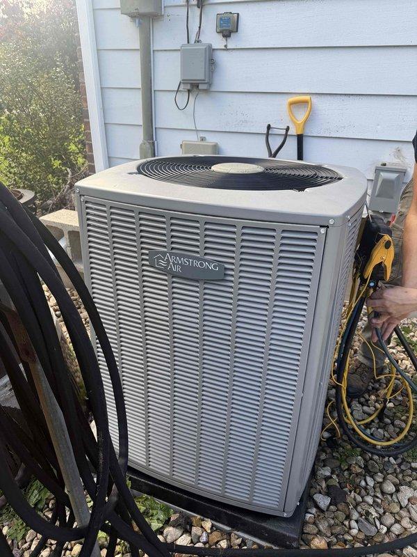 Completed prepaid maintenance visit performing clean and check service on Armstrong Air air conditioning system and furnace. Inspected outdoor condenser unit, verified operational temperatures reading 43.1°F on digital multimeter, cleaned components, and confirmed system functionality. All equipment operating within normal parameters with no issues identified.