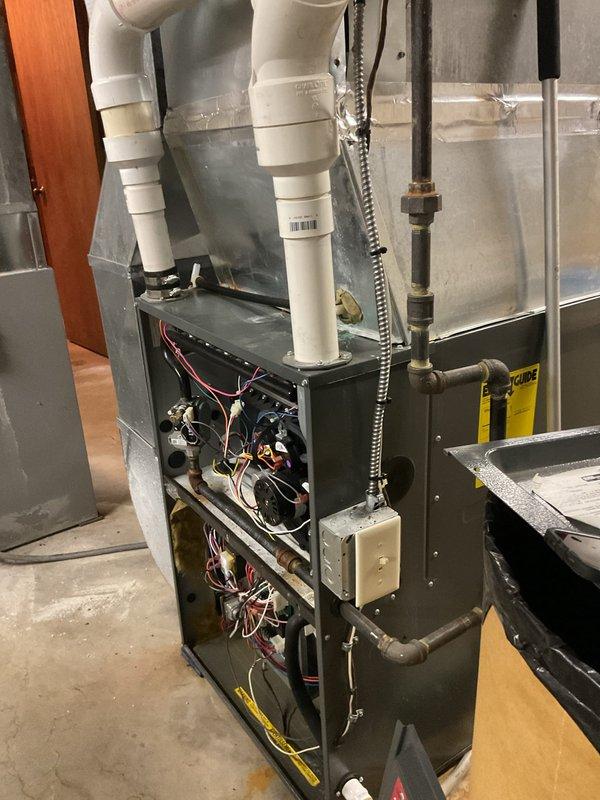 Completed preventive maintenance and clean-and-check service on two furnaces in a residential zone system: a 2016 Goodman GMEC961205DNAB 120,000 BTU/HR gas furnace and a 2013 Airflow unit. Performed comprehensive inspection of both systems including burner assembly cleaning, blower motor examination, electrical connection verification, gas pressure testing, and filter inspection to ensure optimal operation for the heating season.