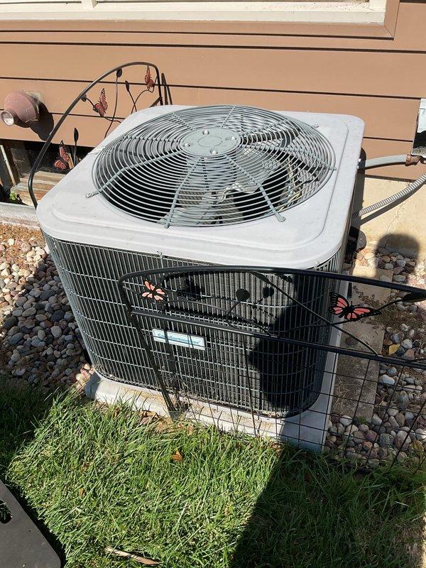 Responded to a no-cooling complaint with the condenser fan not running. Diagnosed a failed start capacitor and a dirty condenser coil. Replaced the capacitor, washed the condenser coil to restore airflow and heat rejection, and verified refrigerant charge was within specification. System restored to normal operation.