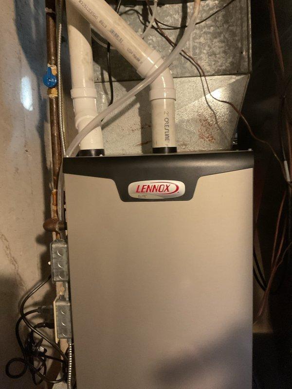 Performed annual cleaning and safety inspection on a Lennox Elite furnace. Cleaned the flame sensor, serviced the condensate drain trap, and tightened electrical connections. Verified proper operation through a full heating cycle, with carbon monoxide readings measured at 28 ppm.