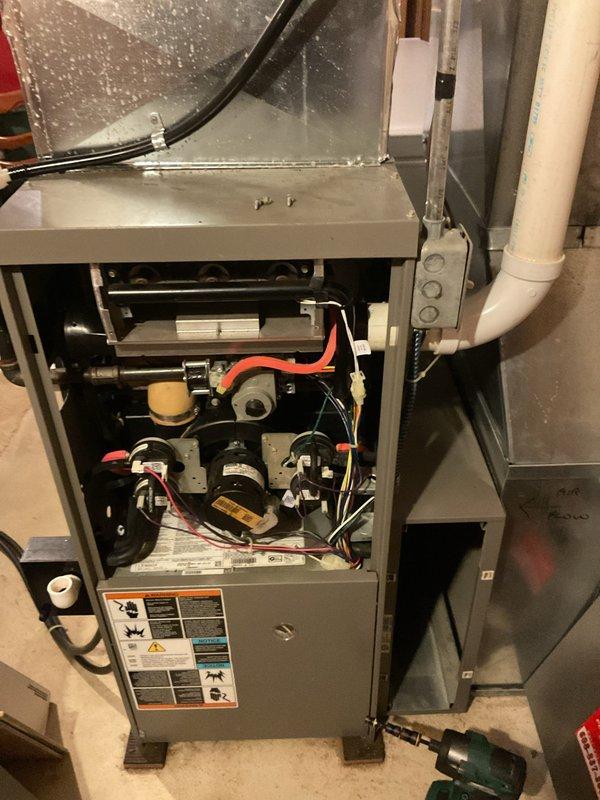 Performed a tune-up on a 2008 Lennox gas furnace, removing the access panels to inspect and clean the blower compartment, inducer assembly, and control components. Verified proper condition of the pressure switches, gas valve, capacitor, wiring harnesses, and condensate drain piping, with no signs of rust, frost, or major damage. System was reassembled and left in good operating condition.