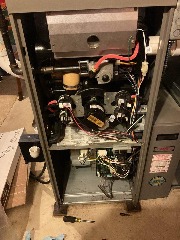 Performed a tune-up on a 2008 Lennox gas furnace, removing the access panels to inspect and clean the blower compartment, inducer assembly, and control components. Verified proper condition of the pressure switches, gas valve, capacitor, wiring harnesses, and condensate drain piping, with no signs of rust, frost, or major damage. System was reassembled and left in good operating condition.