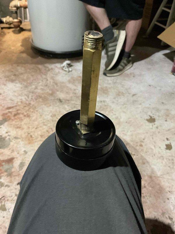 Replaced the boiler sight glass and installed a new pressure gauge. The old gauge snapped off at the fitting, so the corroded, rust-packed remainder was drilled out and the port re-threaded with a tap to accept the new gauge. Both the new gauge and the existing pressure control (pressuretrol) gave inaccurate readings, with the gauge showing 5 psi on a dry system. The pressuretrol tab was adjusted to restore operation, but actual cut-out pressure could not be verified, so further diagnosis and gauge or control replacement are recommended.