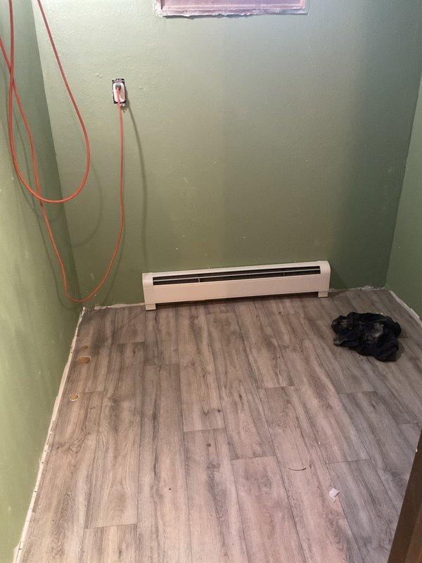 Installed a new 3-foot electric baseboard heater in the existing location along the exterior wall, securing it at the proper clearance above the finished flooring. Connected the unit to the existing line-voltage supply, verified secure terminations, and tested operation to confirm proper heat output and thermostat response.