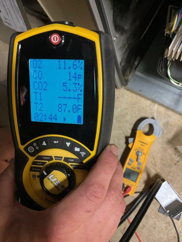 Responded to a no-heat call on a 2022 Lennox gas-fired furnace, verifying operation with the smart thermostat and performing a basic cleaning and safety check of the unit. Combustion analysis was performed with a handheld analyzer, showing CO at 12–14 ppm, CO2 at 5.3%, and O2 at 11.6%, confirming the furnace is firing and operating within safe combustion parameters. Electrical measurements were taken with a clamp meter, and the furnace was left operating normally.