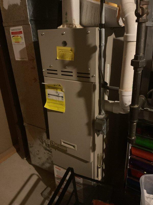 Responded to a no-cooling complaint on a 1985 A/C system that was tripping the fuse at the disconnect. Inspected the Ducane gas furnace/air handler, ductwork, and associated condensate drain, gas, and electrical connections, and found no visible rust, frost, or major damage at the indoor unit. The repeated fuse failure indicates an electrical fault in the aged outdoor condensing unit, likely a shorted compressor, failed capacitor, or shorted contactor. Given the system's age, further diagnosis and repair or replacement options are recommended.
