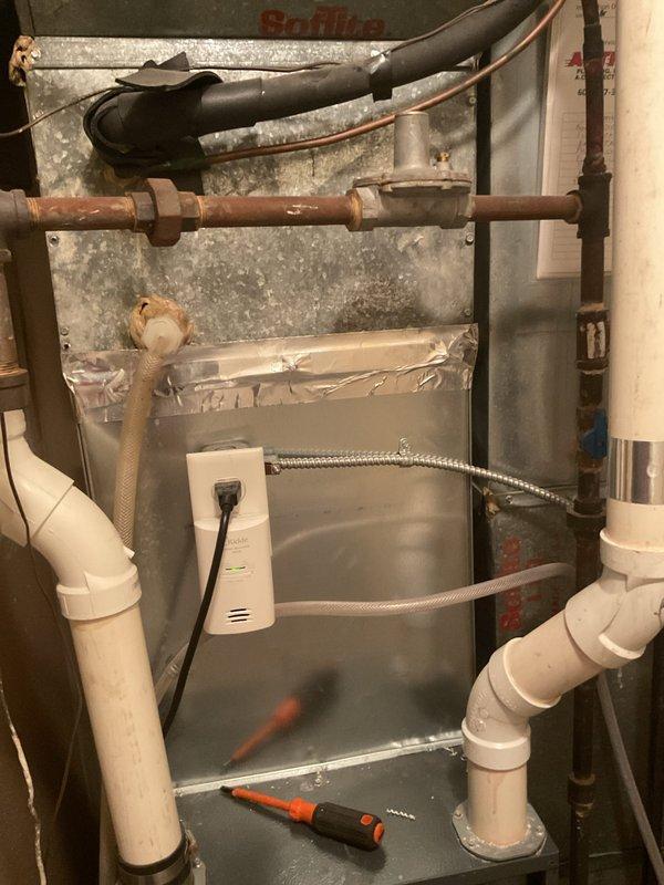 Performed a tune-up on a 2016 Goodman gas-fired furnace, including cleaning and inspection of the burner compartment, gas piping, wiring, and condensate drain system, and replaced the air filter. Noted surface corrosion on the gas piping and debris buildup around the furnace base, and verified the unit was operating properly upon completion.