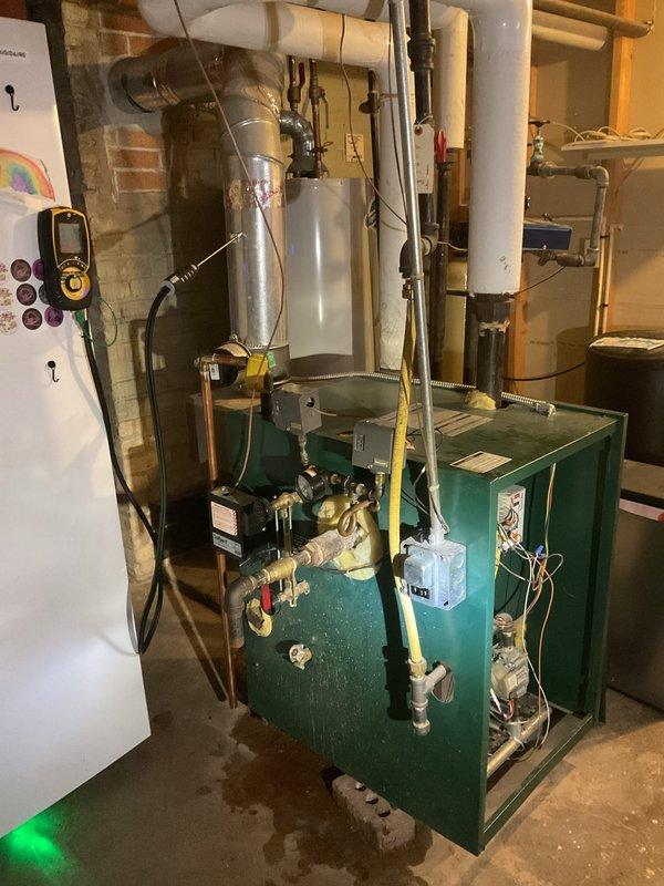 Performed a boiler tune-up and safety inspection, including a combustion analysis of the flue gases with a digital analyzer, and checked the gas train, controls, and pressure gauge for proper operation. Noted a heavily stained and sediment-filled water sight glass and corroded fittings, and recommend glass replacement and further evaluation of the system piping.