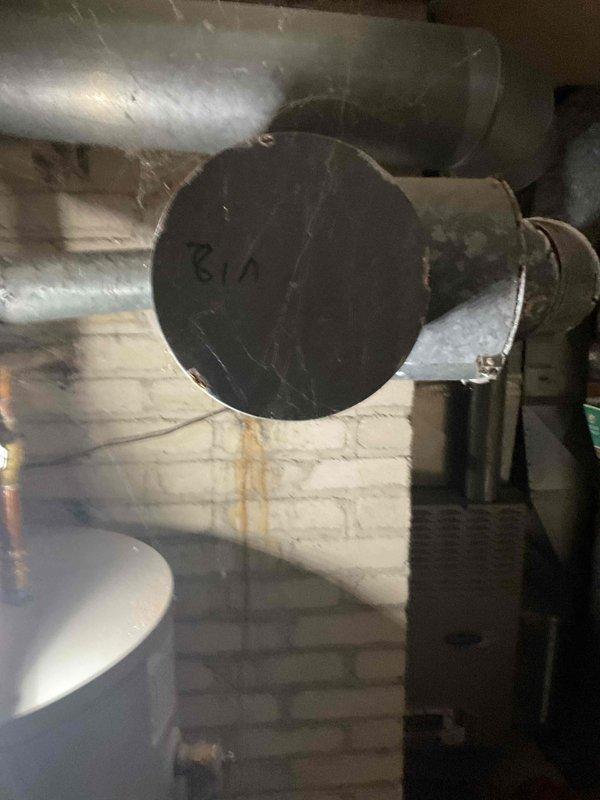 Diagnosed a no-heat condition on a 10-year-old furnace and found a large hole in the flue vent connector at the chimney, creating a combustion venting hazard. Installed a new chimney liner and re-vented the furnace and water heater into the new liner, then restored both appliances to operation and verified proper heat output.