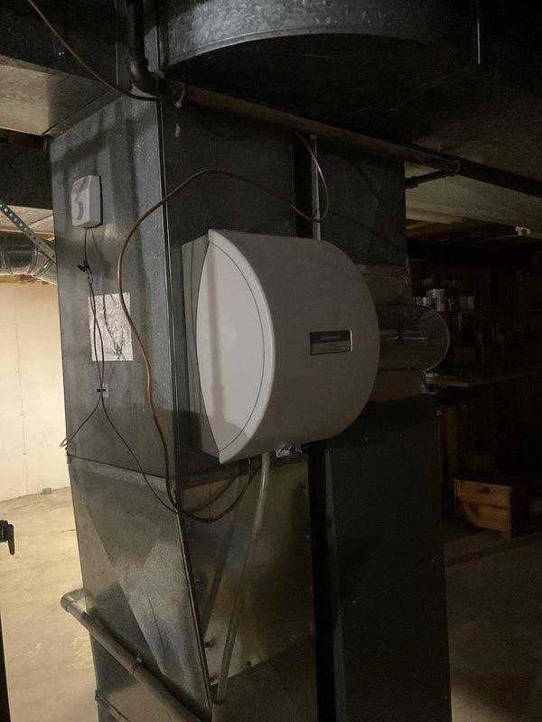 Performed a prepaid maintenance visit on the Lennox gas furnace, including cleaning and a full operational check of the unit, flue connection, gas piping and shutoff valve, and condensate/PVC drain line. Inspected the Honeywell bypass humidifier, humidistat, and associated drain and supply tubing at the supply plenum, and verified the ductwork and refrigerant line connections showed no signs of rust, frost, or damage. Equipment was found in good working condition and operating normally at the conclusion of the visit.