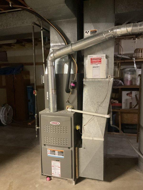 Performed a prepaid maintenance visit on the Lennox gas furnace, including cleaning and a full operational check of the unit, flue connection, gas piping and shutoff valve, and condensate/PVC drain line. Inspected the Honeywell bypass humidifier, humidistat, and associated drain and supply tubing at the supply plenum, and verified the ductwork and refrigerant line connections showed no signs of rust, frost, or damage. Equipment was found in good working condition and operating normally at the conclusion of the visit.
