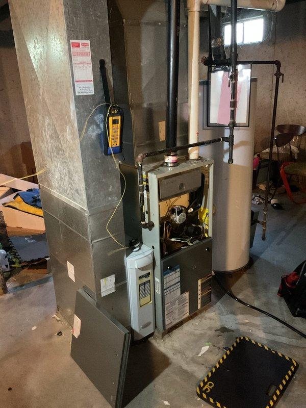 Diagnosed a furnace short cycling issue where the unit would shut down immediately after ignition. Found the pressure switch hose loose and reconnected it, then verified the pressure switch ports were clear of obstruction. Performed a basic cleaning and system check, and confirmed the furnace now completes normal heating cycles.