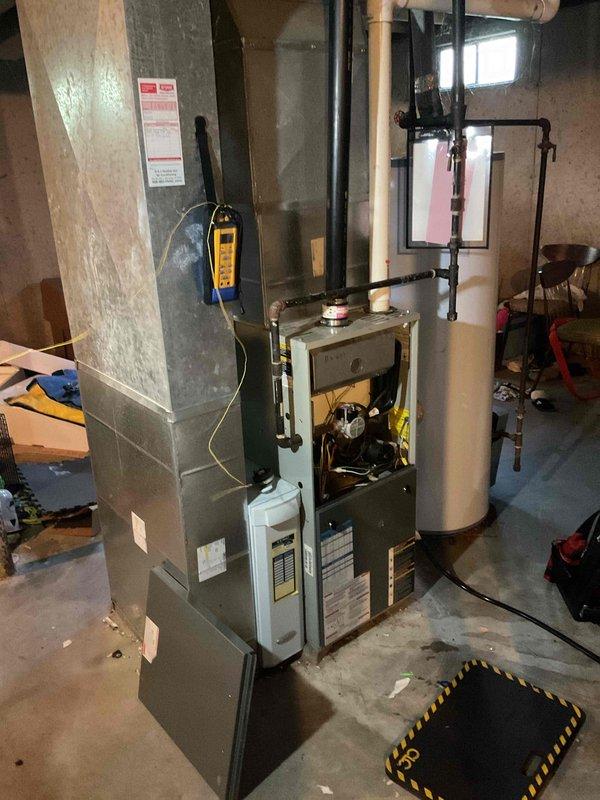 Diagnosed a furnace short cycling issue where the unit would shut down immediately after ignition. Found the pressure switch hose loose and reconnected it, then verified the pressure switch ports were clear of obstruction. Performed a basic cleaning and system check, and confirmed the furnace now completes normal heating cycles.