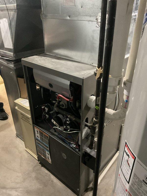 Performed a furnace tune-up on a 20+ year old gas unit, including cleaning and inspecting the burner assembly, wiring, and internal components, and evaluated blower operation per the customer's request for possible replacement. Inspected the attached Aprilaire humidifier, supply line, and drain tube, and verified overall system condition with no visible rust, frost, or breakage noted.