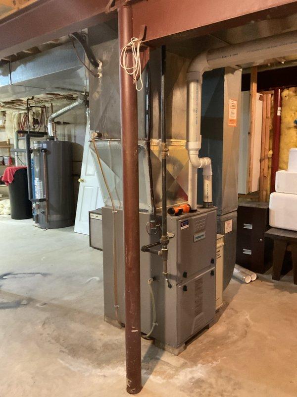 Performed a complete maintenance tune-up on an 11-year-old Comfortmaker gas furnace, including cleaning the unit and inspecting its components, with a carbon monoxide check completed. The furnace was found to be operating normally, with no deficiencies or repairs required.