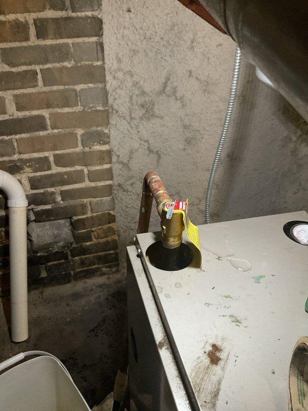Removed the failed boiler pressure relief valve and installed a new relief valve, soldering it into the existing copper piping. Refilled the system with water and purged air to confirm proper operation, with the unit circulating normally and no leaks at the new connection.