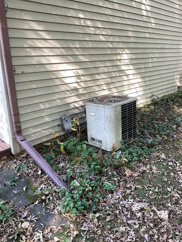 Performed a visual inspection of the Lennox gas furnace to verify that recent maintenance was completed correctly, checking the cabinet, access panels, PVC venting, and supply plenum/ductwork, with no evidence of rust, frost, or damage found. Also inspected the outdoor condenser, noting heavy debris and vegetation around the unit that should be cleared to maintain proper airflow.