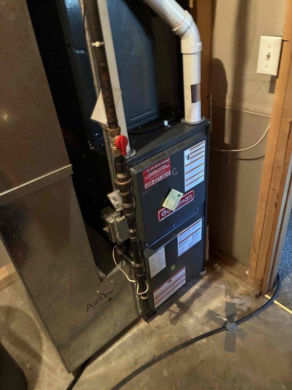 Performed a complete furnace clean and check on a Goodman vertical gas furnace, cleaning the unit and inspecting its components for proper operation. Verified the gas supply line and shutoff valve, PVC venting, and surrounding ductwork were secure and in good condition, with no signs of rust or damage. The system was left clean and operating properly.