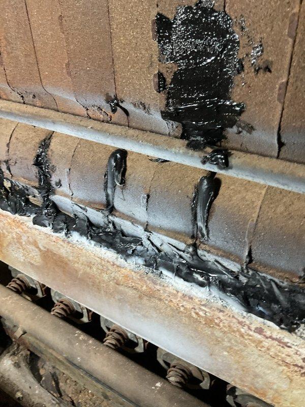 Inspected the boiler and found it in severely deteriorated condition, with extensive corrosion on the heat exchanger sections and internal components, as well as heavy soot buildup. Prior temporary repairs were evident, with uneven sealant applied across seams and joints that has failed to provide a reliable fix. Due to the advanced corrosion and compromised integrity, the unit was determined unsafe for continued operation, and full boiler replacement is recommended.