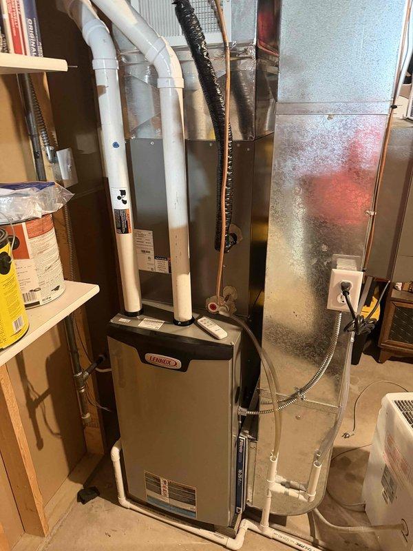 Performed a complete clean and check on a 3-year-old Lennox gas furnace, inspecting the burner assembly, venting, condensate drain, and electrical connections, and verifying proper operation and heat output. The unit is running efficiently with no damage, rust, or leaks observed, and the attached whole-home humidifier was also inspected. Completed ahead of warranty expiration to ensure the system remains in good working condition.