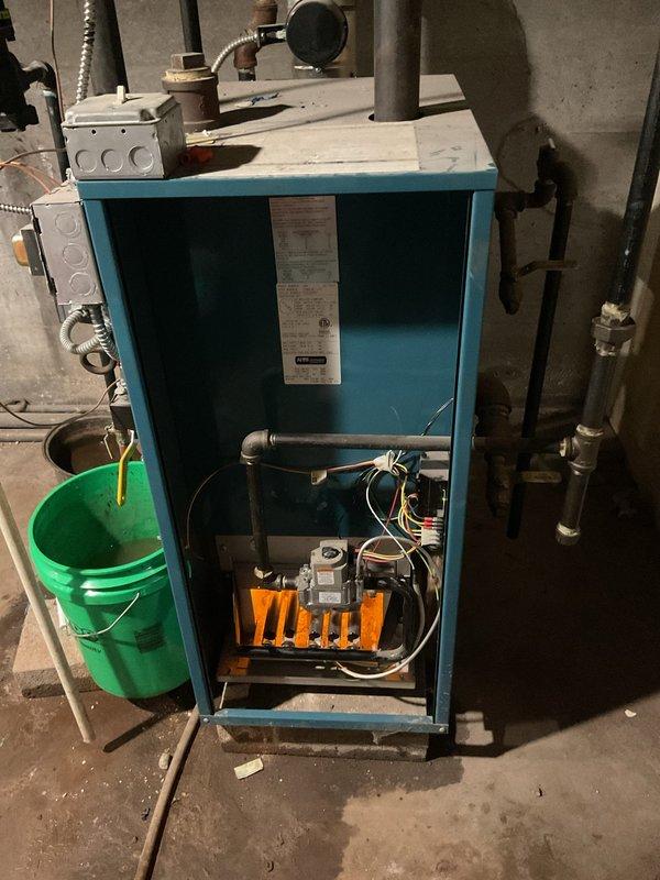 Performed a tune-up and safety inspection on a steam boiler. Found the pressure control pigtail heavily fouled and plugged, preventing the pressuretrol from operating. Cleared and cleaned the pigtail, then blew down approximately 15 gallons of water to flush the system, and verified the boiler fired back up and operated properly.