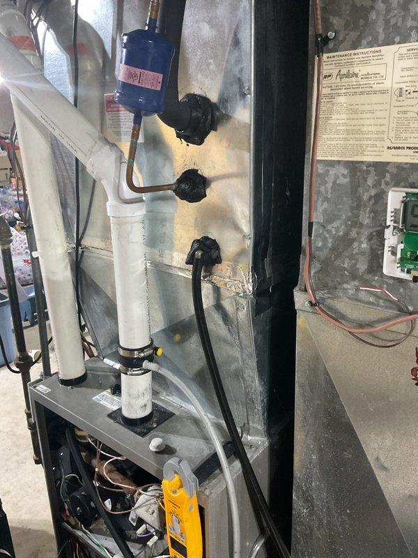 Performed a scheduled furnace cleaning and safety inspection on a 2011 Lennox gas furnace, checking the cabinet interior, wiring connections, condensate drain, and ductwork penetrations for proper sealing and condition. Activated and verified operation of the Aprilaire whole-house humidifier system, confirming proper control wiring and water supply connections. Equipment was found intact and operating normally, with no leaks, damage, or corrosion observed.