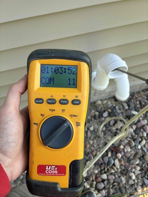 Performed prepaid cooling and heating system maintenance, including a complete clean and check of the A/C and the Ruud Achiever 90 Plus gas furnace. Combustion safety was verified by sampling flue exhaust at the PVC vent termination with a UEi CO95 carbon monoxide analyzer. Found a dirty air filter and replaced it with a customer-supplied filter; no visible frost, rust, or damage observed on the equipment.