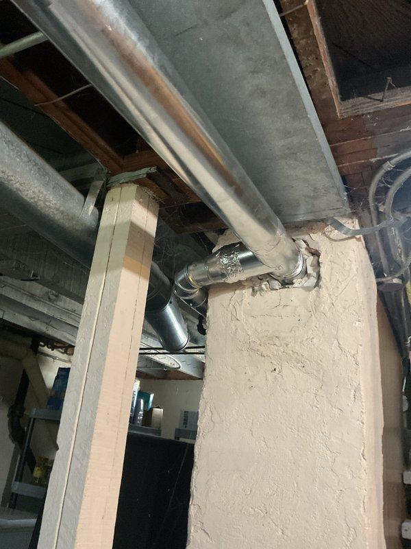 Replaced the galvanized metal furnace exhaust flue pipe, including the elbow and the connection into the masonry chimney chase. Installed new vent piping with secure, sealed joints and verified proper fit and routing from the furnace to the chimney entry, restoring a safe venting path for combustion gases.