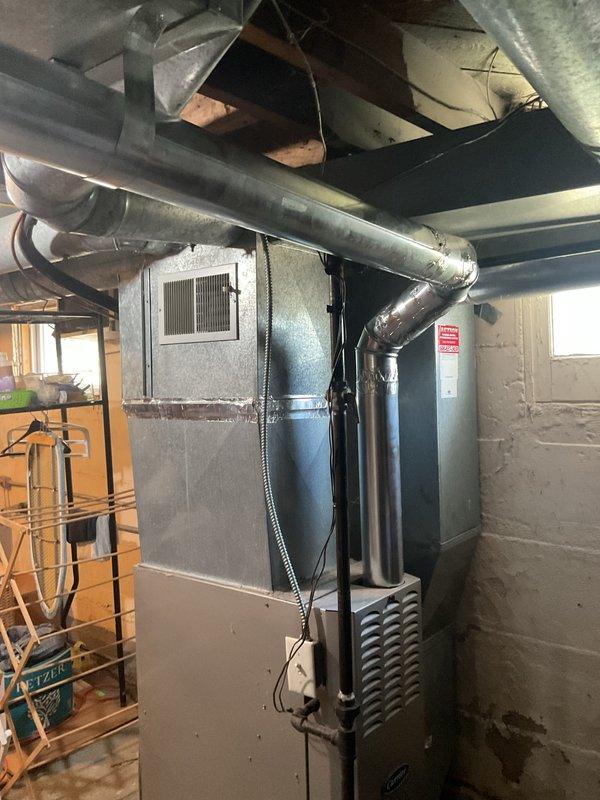 Replaced the galvanized metal furnace exhaust flue pipe, including the elbow and the connection into the masonry chimney chase. Installed new vent piping with secure, sealed joints and verified proper fit and routing from the furnace to the chimney entry, restoring a safe venting path for combustion gases.
