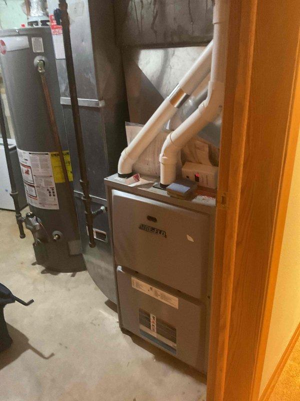 Performed a furnace tune-up on an Aire-Flo gas furnace, including cleaning the unit and inspecting its components and operation. Verified the PVC venting and intake piping and found no visible damage, rust, or deficiencies, and the unit was left clean and operating properly.