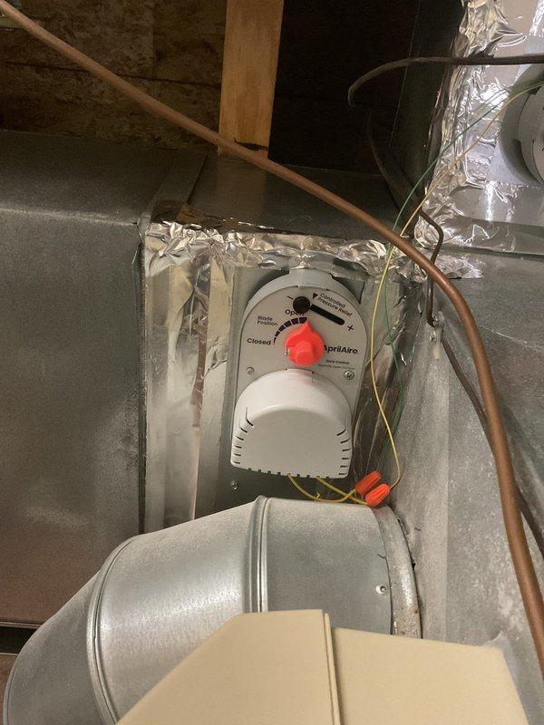 Replaced two zone dampers by removing the existing units and installing new AprilAire zone damper actuators on the supply plenum ductwork. Wired each actuator with secured wire nut connections, sealed duct transitions with foil tape, and verified proper blade positioning and operation for each zone.