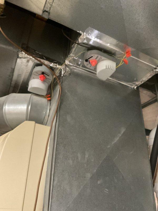 Replaced two zone dampers by removing the existing units and installing new AprilAire zone damper actuators on the supply plenum ductwork. Wired each actuator with secured wire nut connections, sealed duct transitions with foil tape, and verified proper blade positioning and operation for each zone.
