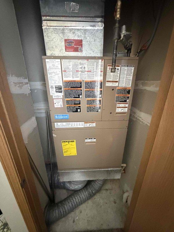 Performed a tune-up on the Magicpak furnace/air handler unit, including cleaning and inspecting components, checking gas piping and connections, and verifying proper operation. Replaced the air filter and cleaned the exterior intake/exhaust grille. No rust, frost, or significant damage was observed.