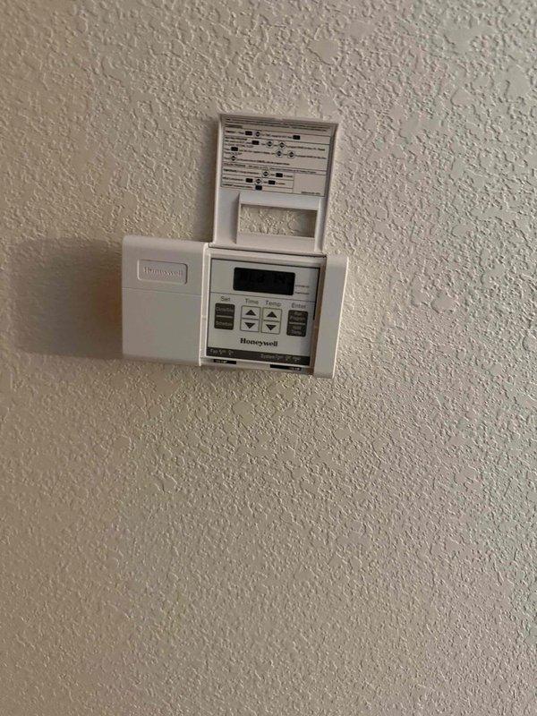 Performed a clean and check on a 2003 Bryant gas furnace, inspecting the burner assembly, heat exchanger, blower assembly, and gas connections for proper operation and safe combustion. Verified the Honeywell programmable thermostat calls for heat and cycles the furnace correctly, and confirmed the gas line, regulator, and shutoff valve are intact with no leaks observed.