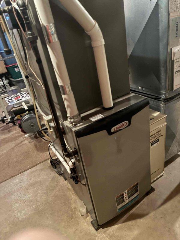 Performed a tune-up and cleaning on a Lennox gas furnace, inspecting the unit and verifying proper operation with a CO analyzer. Found a dirty filter and replaced it with a customer-supplied filter. No visible rust, cracks, or damage noted on the equipment.